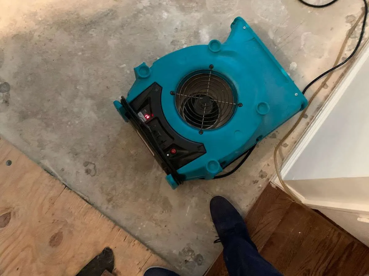 Air mover drying subfloor during Leak Detection & Repair in Eastvale